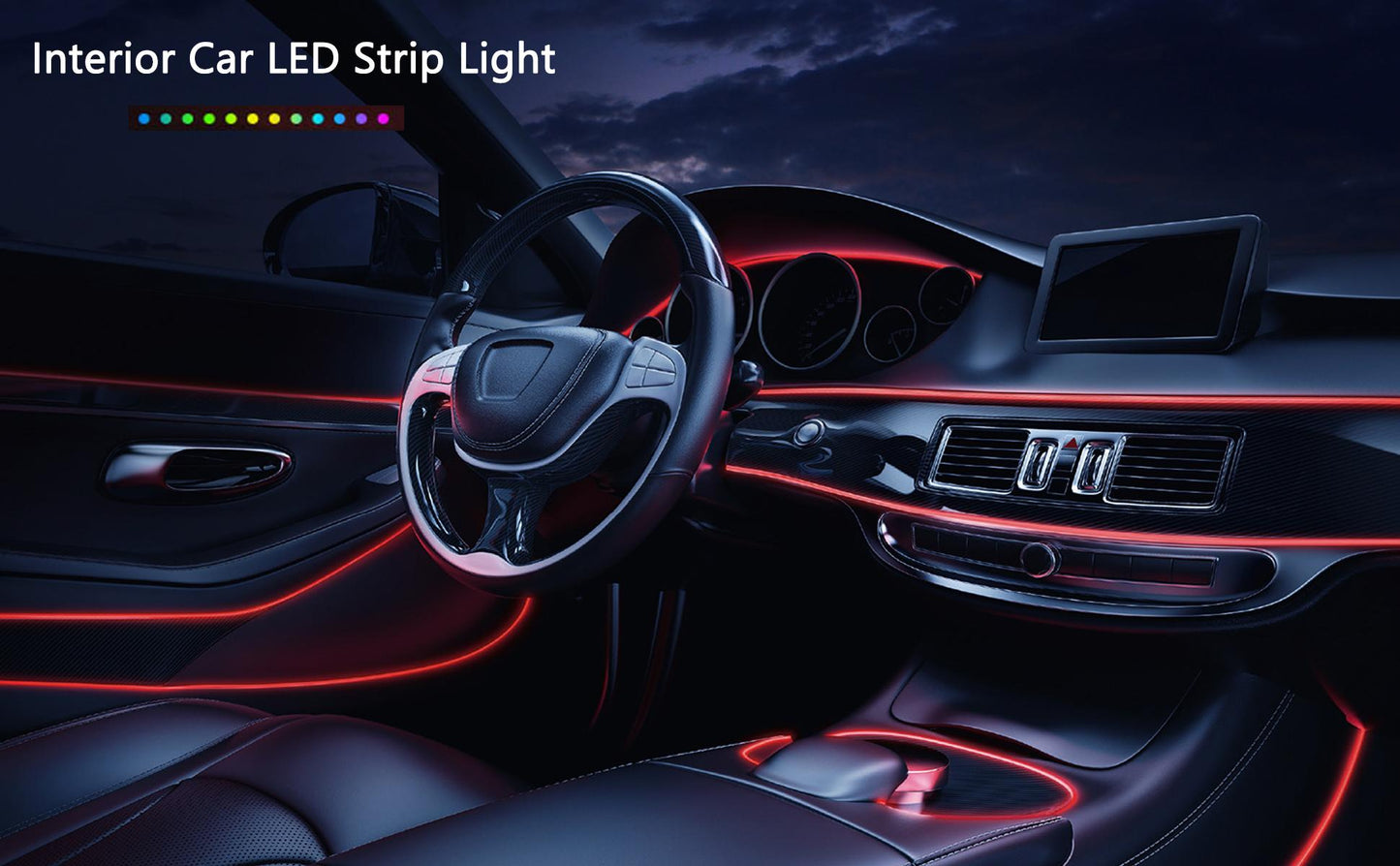 Car interior with red LED strip lights highlighting the dashboard and steering wheel.